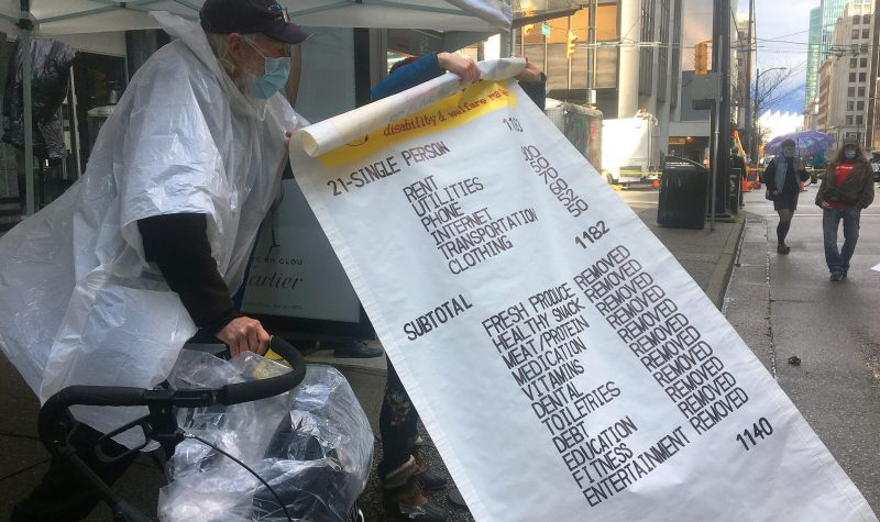 Giant novelty receipt showing expenses for people who depend on B.C. disability assistance