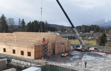 A building being constructed with a crane.