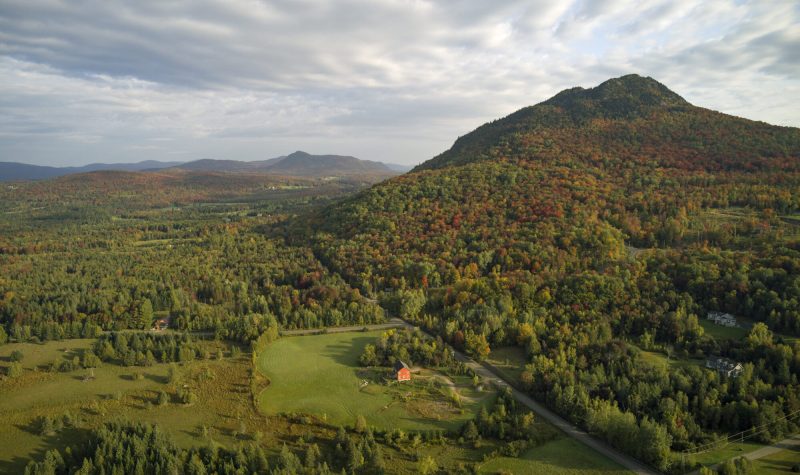 Pictured is an aerial view shot of Owl's Head in Potton with early fall foliage.