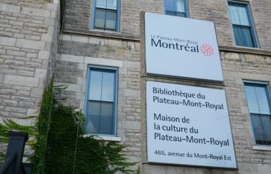 A sign before a stone building facade shows the Maison de la culture du Plateau-Mont-Royal