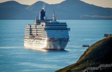 A photo of an international cruise ship anchored near the Magdalen Islands