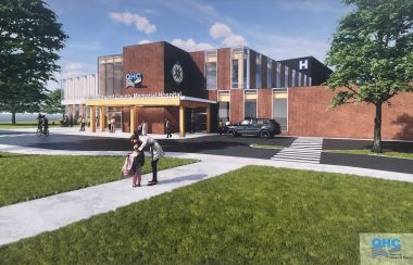 An artist's rendition of a modern hospital building, blue sky in the background, clean landscaping in the foreground featuring deciduous trees and grass lawn