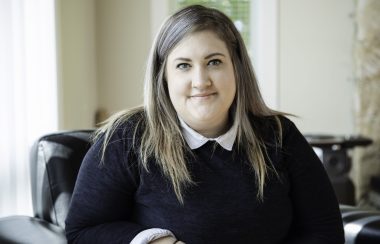 A photo of Kyrsten Boucher at her desk.