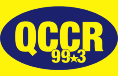 A blue oval with the letters QCCR 99.3 on a yellow background.