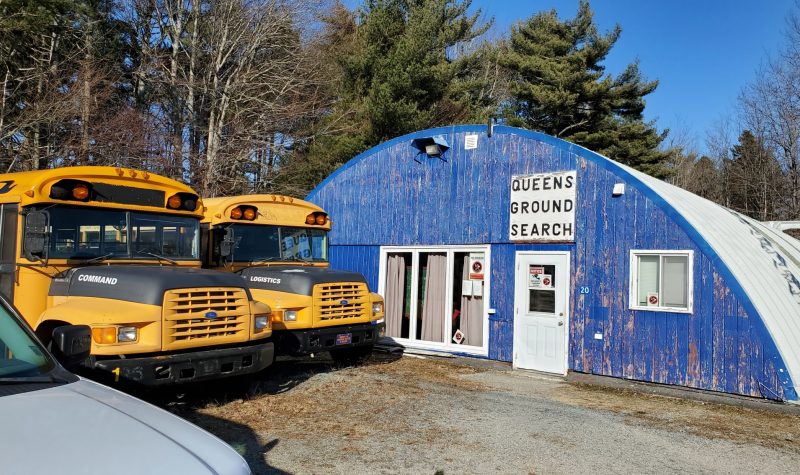 Two school buses parked outside Queens Ground Search and Rescue building