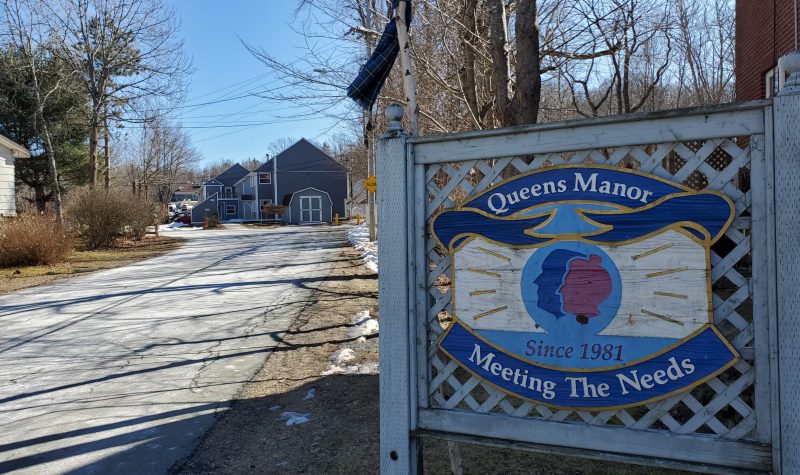 Entrance sign at the end of the driveway to Queens Manor