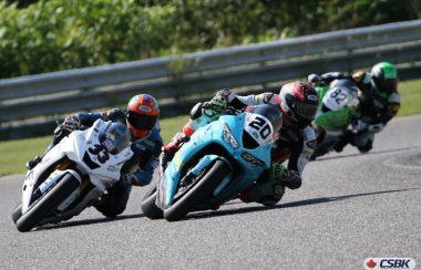 Three motorcycles racing down the track during the second round of the CSBK championships.