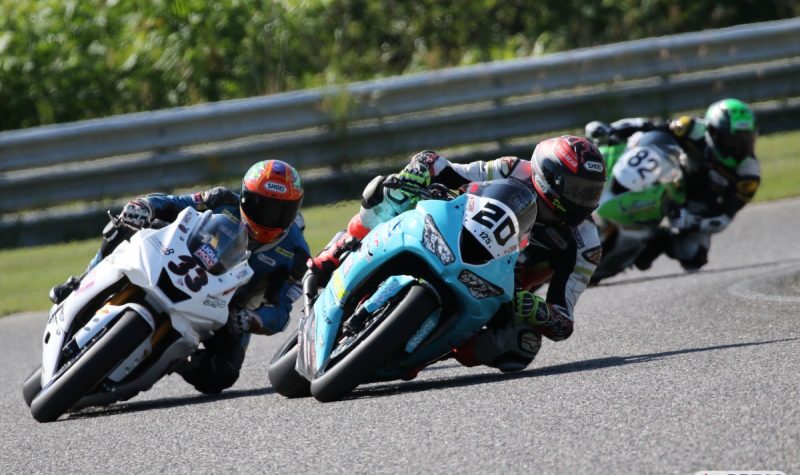 Three motorcycles racing down the track during the second round of the CSBK championships.