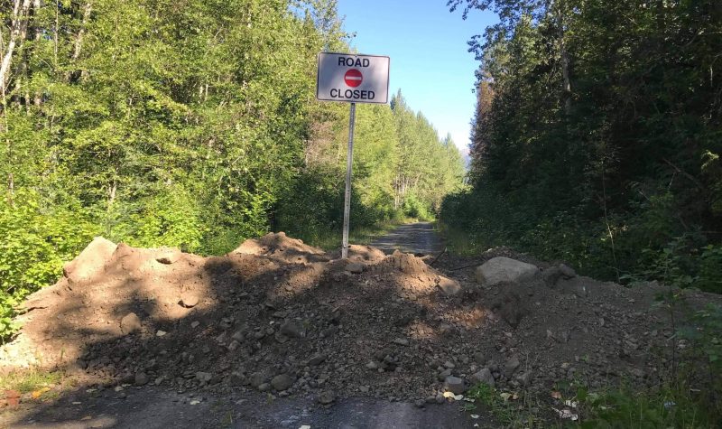 A sign in the woods shows that Suskwa is closed at 18km