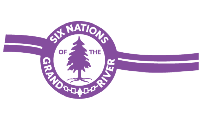Purple lines running diagonally. A purple circle is centered on the lines with a purple tree in the middle of it. The text Six Nations of the Grand River is spelled out surrounding the purple circle.