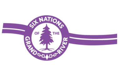 Purple lines running diagonally. A purple circle is centered on the lines with a purple tree in the middle of it. The text Six Nations of the Grand River is spelled out surrounding the purple circle.