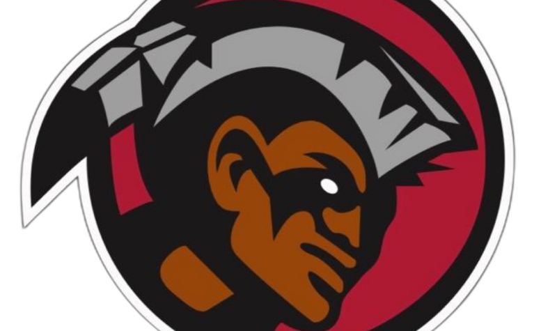 Six Nations Rivermen team logo. A portrait of a man in a red circle with grey hair and a grey feather on the back of the head.