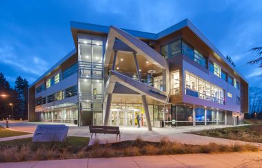 A night photo of the student union building at the university of the Fraser Valley