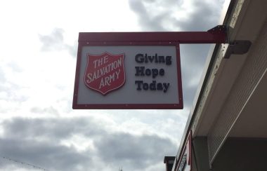 A sign hangs above main street in smithers that says the salvation army giving hope today