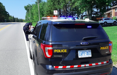 A Wellington County OPP officer is seen pulling someone over.