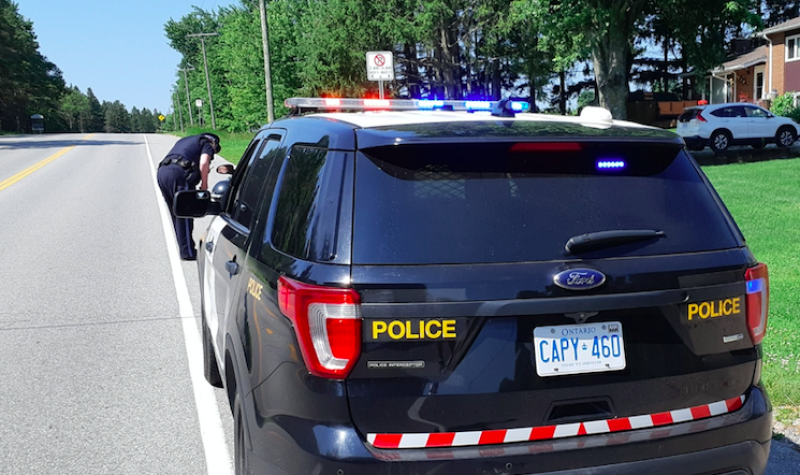 A Wellington County OPP officer is seen pulling someone over.