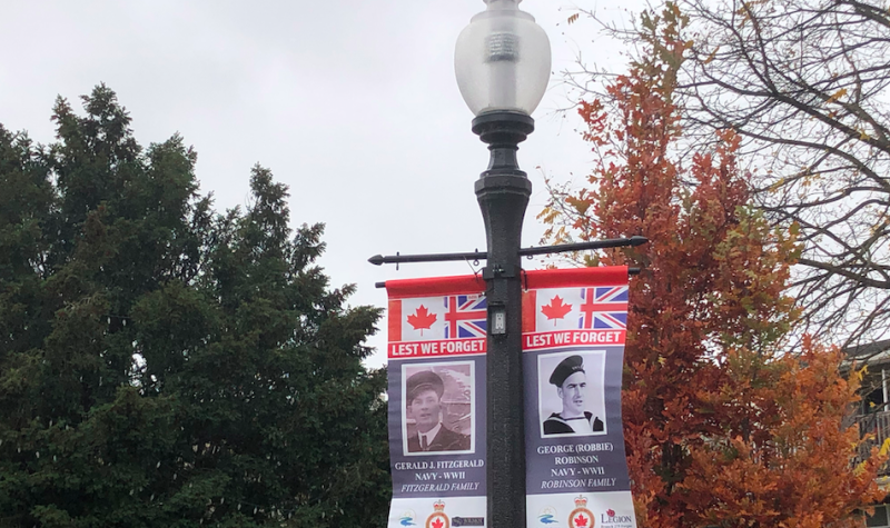 A Remembrance Day banner of Gerald J. Fitzgerald and George (Robbie) Robinson is shown in the Templin Gardens in Fergus, Ontario.