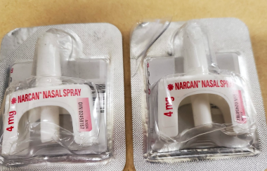 A photo of the nasal spray version of naloxone (Narcan) is shown.