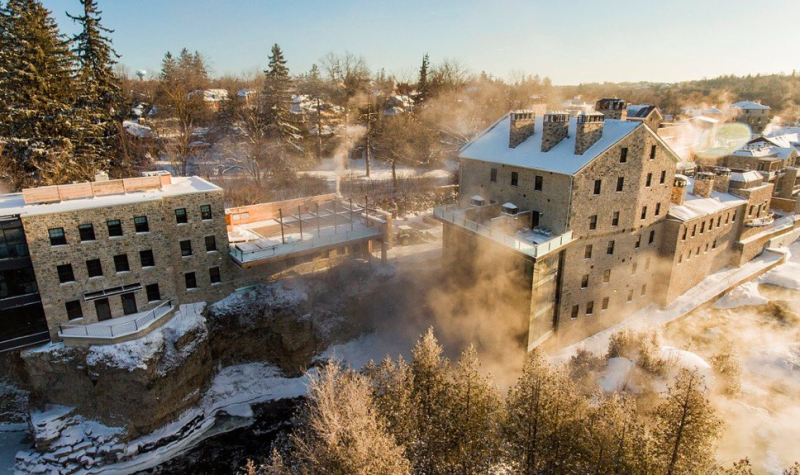 An aeriel shot of the Elora Mill Hotel and Spa on a sunny winter day.