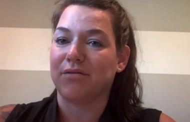 Youtube screencap of woman speaking at online meeting