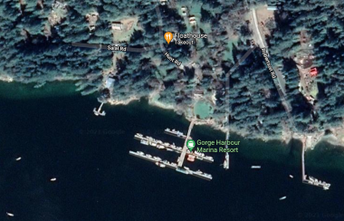 Satellite view of Gorge Harbour Marina Resort shows docks, location of Floathouse restaurant, roads, buildings and trees