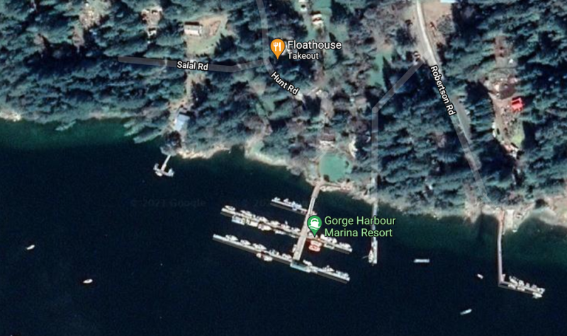 Satellite view of Gorge Harbour Marina Resort shows docks, location of Floathouse restaurant, roads, buildings and trees