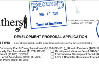 A black and white screenshot of a development proposal application to the Town of Smithers with two royal blue stamps on top.