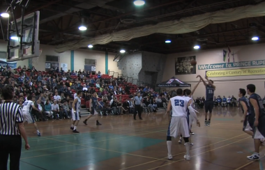 A group of young men play basketball in the All Native BAsketball Tournament in Prince Rupert, BC