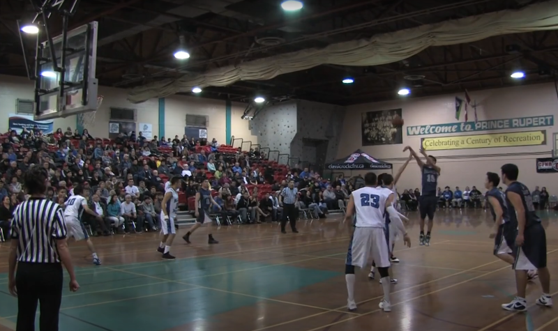 A group of young men play basketball in the All Native BAsketball Tournament in Prince Rupert, BC