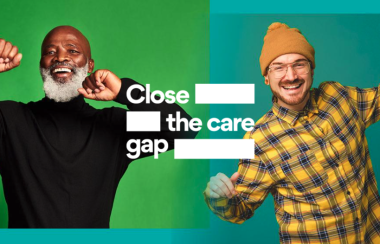 Two men look jubilant with the words close the care gap written between them. The image is used for cancer awareness.