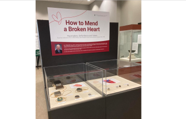 Photo of the exhibit' How to Mend a broken heart' which is available at the Museum of Natural History for three weeks. There is a glass encasing with different heart valves and pacemakers throughout the years.