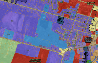 A detail of a zoning map with properties in different colours.