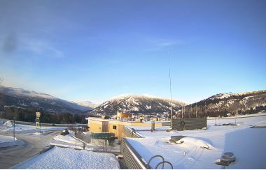 webcam photo of castlegar airport. showing snowy mountains in the background