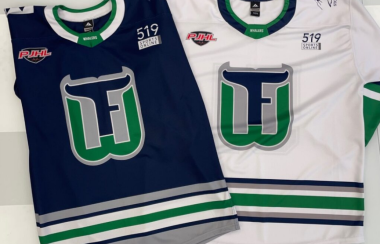 Two jerseys modelled after the Hartford Whalers' green blue and white have a Fergus F W crescent in the middle. A white and blue version lay across the image.