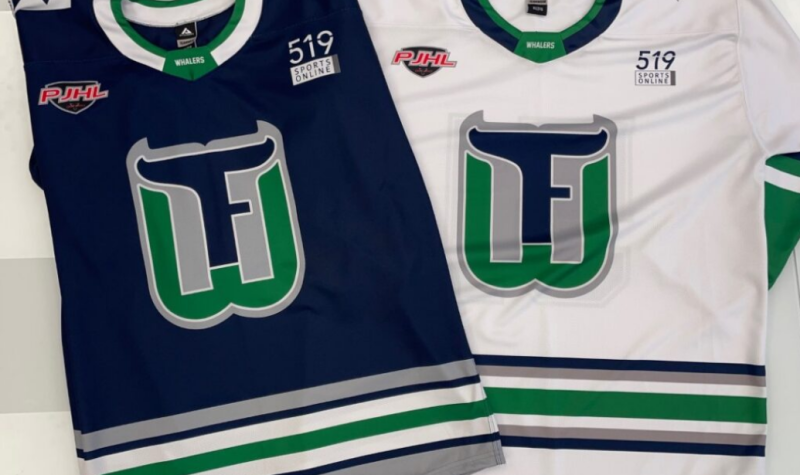 Two jerseys modelled after the Hartford Whalers' green blue and white have a Fergus F W crescent in the middle. A white and blue version lay across the image.