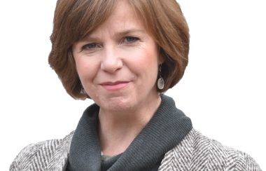 Sheila Malcolmson in front of a white background