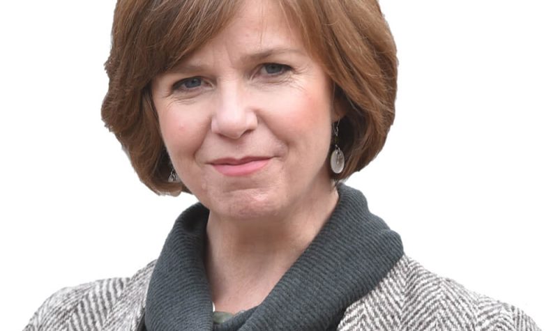Sheila Malcolmson in front of a white background