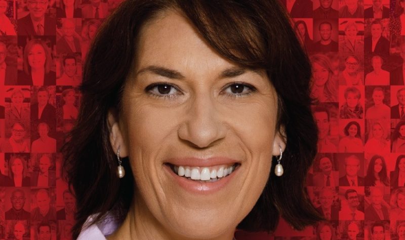 A professional headshot on a red background of Pontiac Liberal candidate Sophie Chatel.