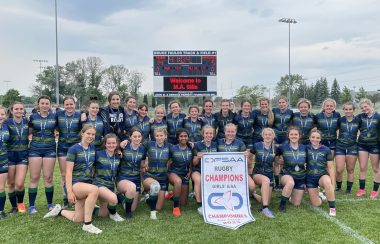 Rugby team photo with championship banner