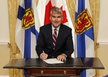 Premier Stephen McNeil signs minister's oath of office. Photo credit: Nova Scotia Government