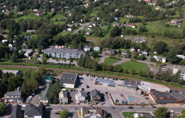 An overhead shot of the town of Sutton with a seniors’ residence and an empty lot in the foreground.