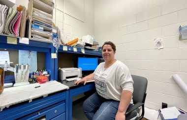 PHD Candidate Amal El Nabbout sitting in her office as she works on her new research.