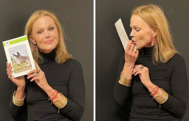 Belinda Carlisle kisses and holds a picture of 'Duke'