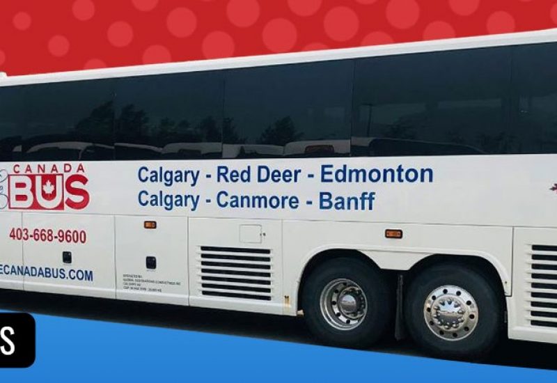 White coach bus that reads Calgary-Red Deer-Edmonton, Calgary-Canmore-Banff