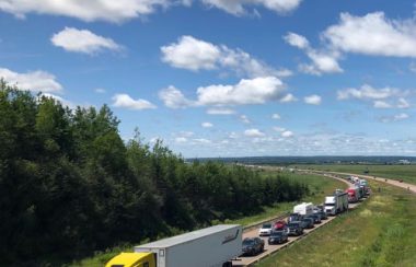Traffic waits to cross into Nova Scotia on day one of the Atlantic Bubble, July 3, 2020. Photo: James Anderson.