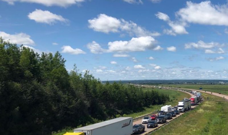 Traffic waits to cross into Nova Scotia on day one of the Atlantic Bubble, July 3, 2020. Photo: James Anderson.