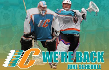 2 lacrosse goaltenders in full goalie equipment in the foreground with a light blue and orange background with text that says we're back and including upcoming lacrosse game dates.