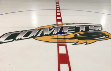 The logo of the Pontiac Senior Comets inlayed at centre ice.