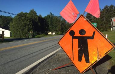 A roadside construction sign