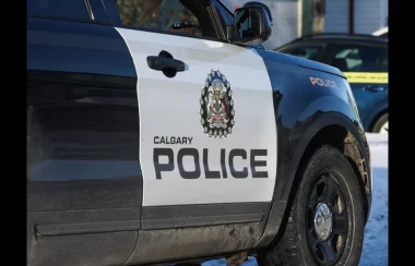 A police cruiser with 'Calgary Police Service' along the two side doors.